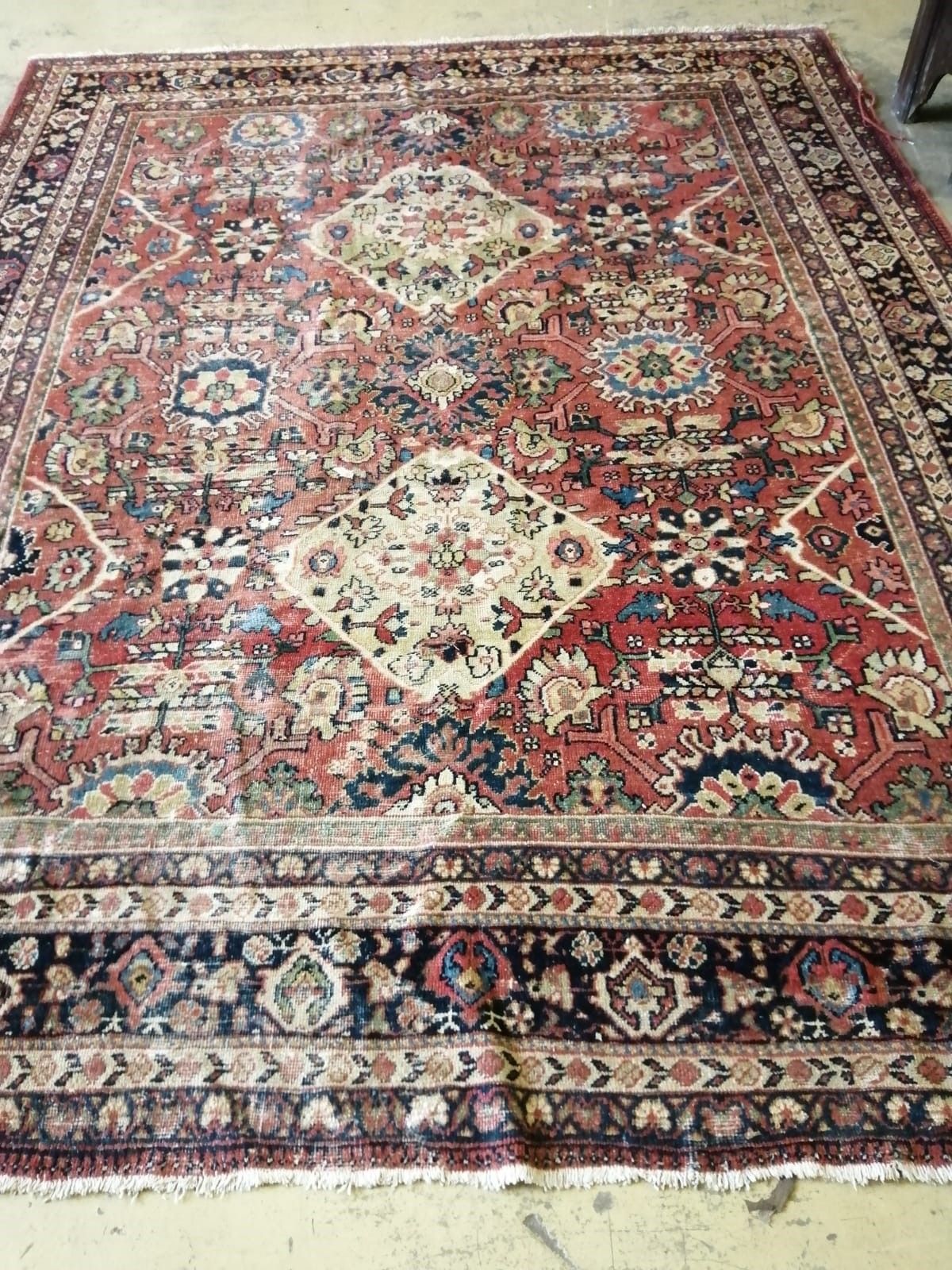 A Caucasian red ground carpet, 340 x 268cm